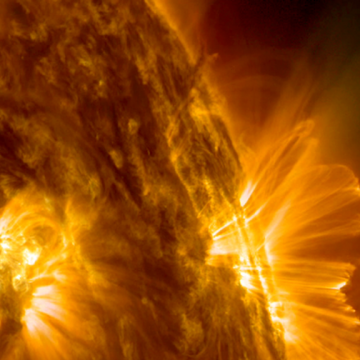 A plasma ejection is seen during a solar flare. Immediately after the eruption, cascades of magnetic loops form over the eruption area as the magnetic fields attempt to reorganize. (NASA/SDO and the AIA, EVE and HMI science teams)