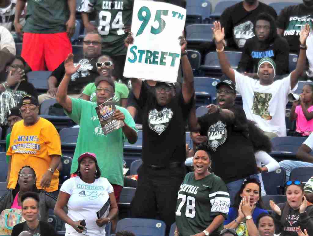 TOUCHDOWN: Miami Central High School fans react to a first-quarter score that put the nation’s No. 6 team up 10-0 toward a 37-27 victory over Bothell (WA), in the second game of the inaugural State Championship Bowl Series, Saturday at FAU Stadium in Boca Raton. Fourth-ranked Miami-Booker T. Washington delivered No. 8 Bingham (of South Jordan, Utah) a 34-28 overtime, comeback defeat in the finale of the daylong, three-game event. 