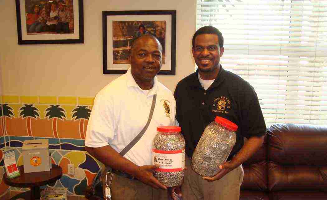 The brothers of the Iota Pi Lambda Chapter of Alpha Phi Alpha Fraternity Inc. participated in the Ronald McDonald House Charities (RMHC) of South Florida’s annual soda pop tab collection contest.  The pop tab collection drive is an annual initiative conducted by RMHC to raise funds to house families while their children receive specialized treatment for unique medical conditions. Families staying at the McDonald House come from around the globe to receive medical care from one of several specialty hospitals in Miami-Dade County.  The high-grade aluminum from the collected can tabs are recycled and weight assigned a dollar value that is donated to the center. Pictured left are members Chris Stevenson and Leslie Elus holding a portion of the chapter’s donation to the center.
